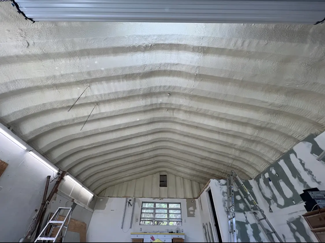 Spray polyurethane foam applied to the underside of a metal roof deck in Warrenton